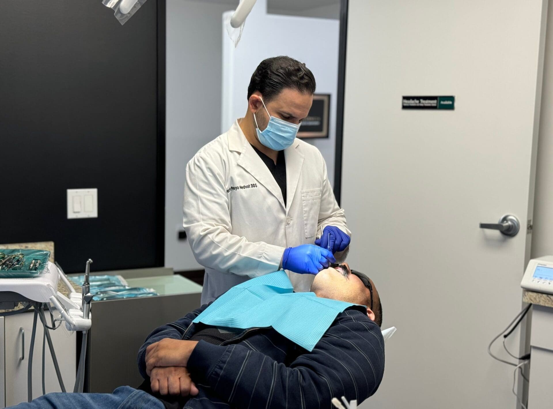 Dr. Hedvat providing gentle treatment to a patient